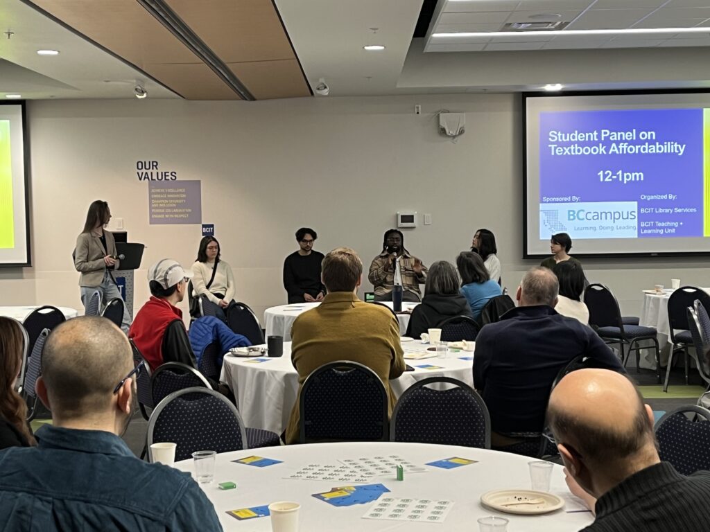 Panelists and a mediator presenting to guests at a ZTC event.